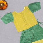 Girls green ethnic top and skirt set by Boon Babies, featuring cotton lining and traditional design, perfect for festive occasions.