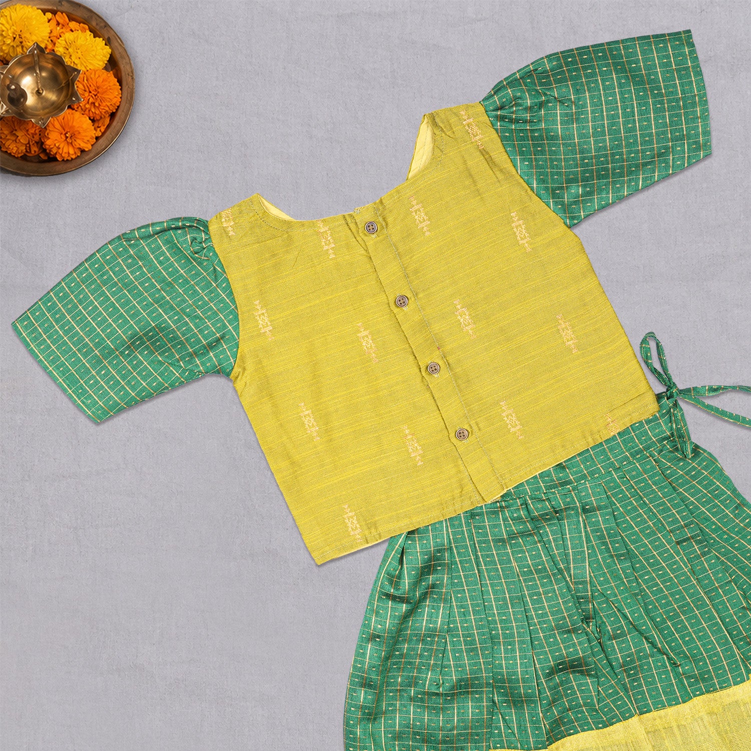 Girls green ethnic top and skirt set by Boon Babies, featuring cotton lining and traditional design, perfect for festive occasions.