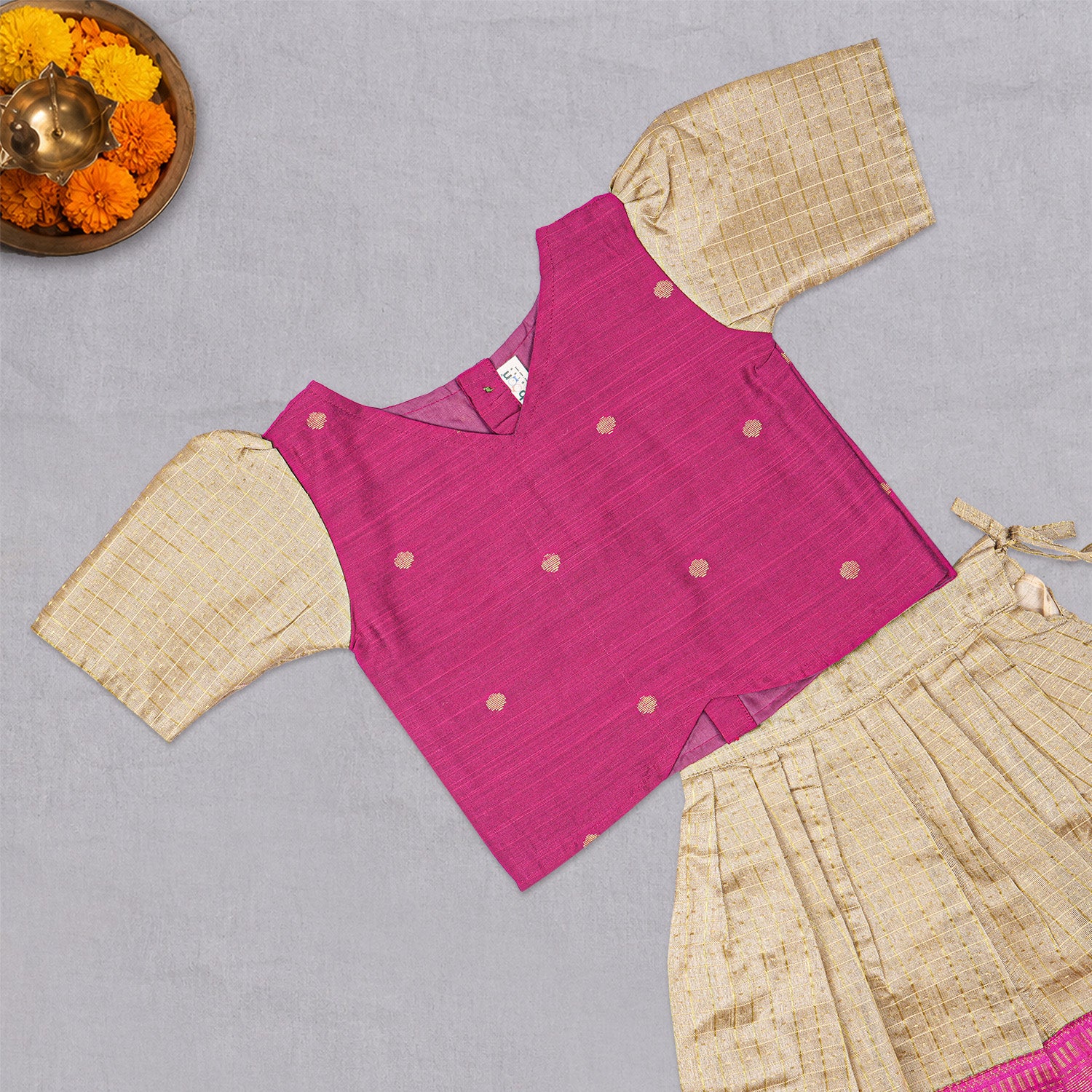 Girls beige and pink ethnic top and skirt set by Boon Babies, featuring traditional patterns and comfortable fabric.