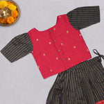 Girls black and red ethnic top and skirt set by Boon Babies, featuring traditional design and vibrant fabric details.