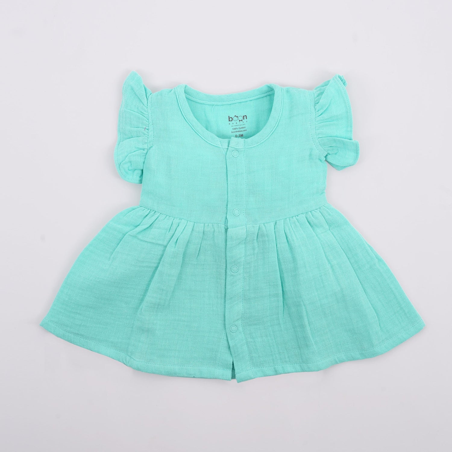 Baby girl crinkled mint green muslin frill frock from Boon Babies, featuring a soft solid fabric with delicate frill details.
