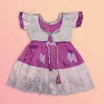 Elegant purple and silver ethnic frock for girls by Boon Babies, featuring intricate Pattu design and traditional craftsmanship.