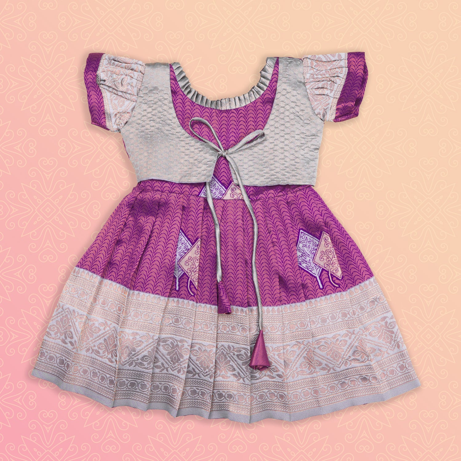 Elegant purple and silver ethnic frock for girls by Boon Babies, featuring intricate Pattu design and traditional craftsmanship.