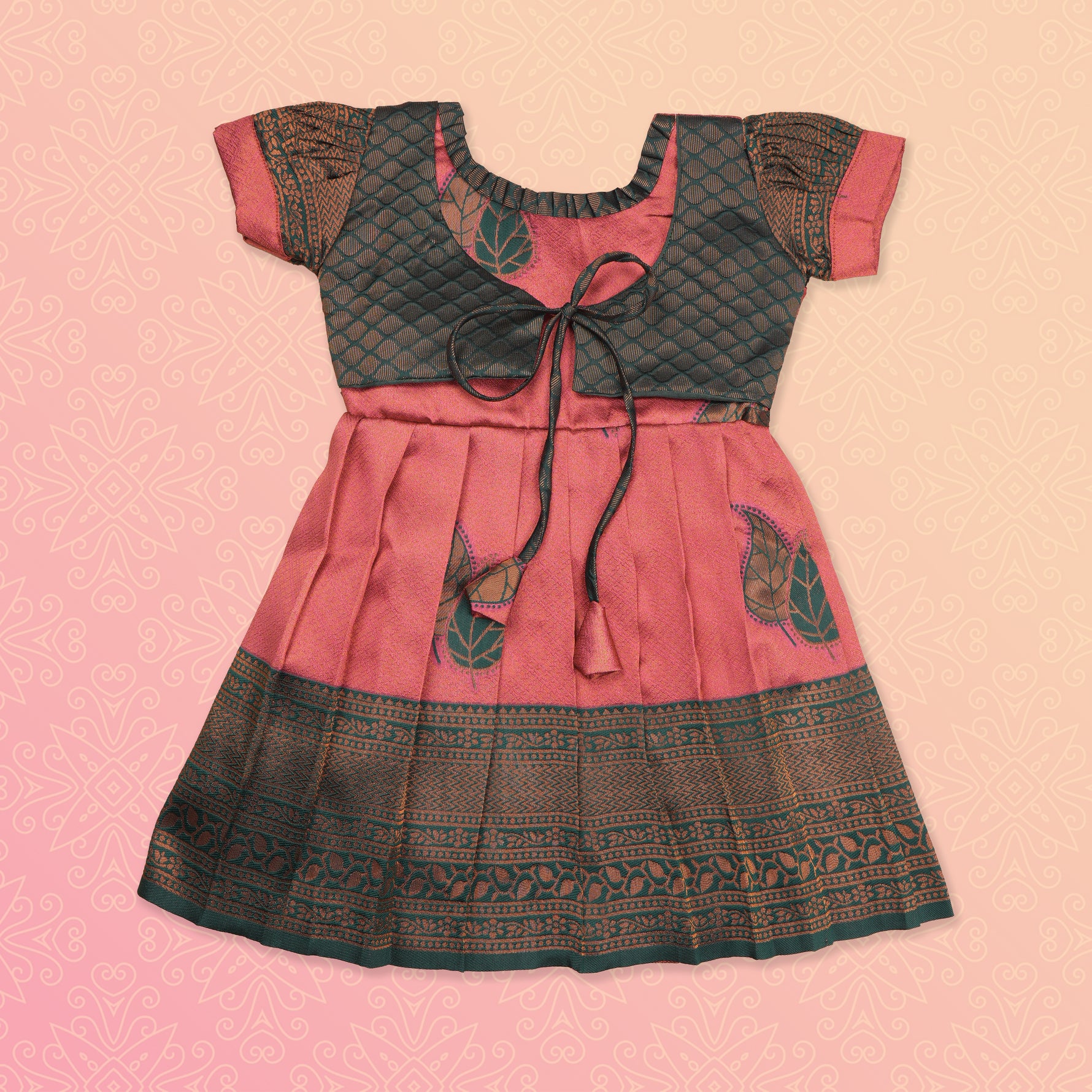 Girls' peach and green tissue silk Pattu Pavadai ethnic frock by Boon Babies, featuring intricate traditional design and elegant fabric.
