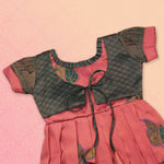 Girls' peach and green tissue silk Pattu Pavadai ethnic frock by Boon Babies with intricate traditional embroidery.