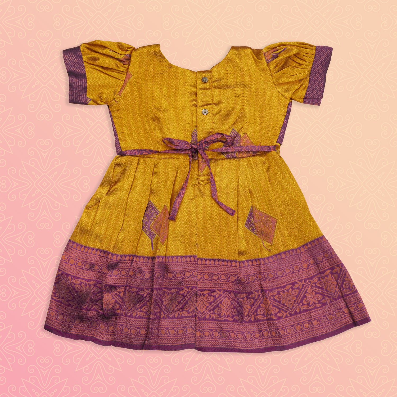 Ethnic girls' frock in mustard purple with intricate embroidery, by Boon Babies, featuring traditional design and vibrant fabric.