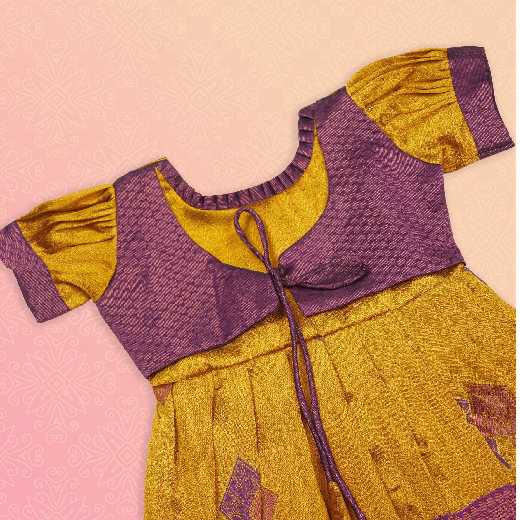 Girls' ethnic Pattu frock in mustard purple by Boon Babies, featuring traditional design and intricate fabric details.