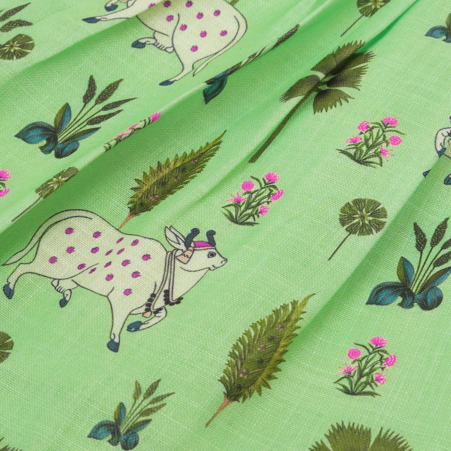 Cute sleeveless cotton frock in green with deer & floral prints. Ages 1–4 years. Soft, breathable & perfect for festive and casual looks.