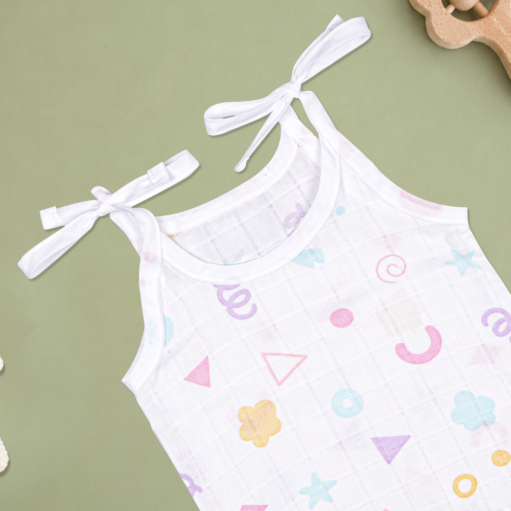 Soft printed boonbabies muslin knot jabla for babies, 0–6 months, featuring a tie-up design and comfortable, lightweight fabric.