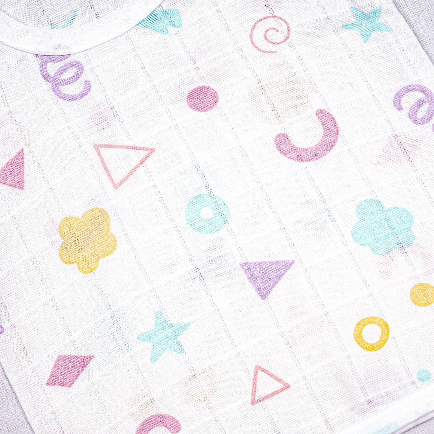 Soft printed Boonbabies muslin knot jabla for babies aged 0-6 months, featuring a cute tie-up top with comfortable fabric.
