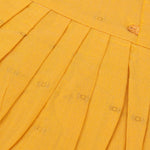 Mustard yellow silk knot frock with zari border for baby girls (0–12 months). Traditional, festive & comfortable.