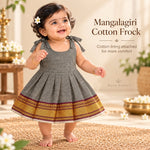 Baby girl wearing charcoal grey Mangalagiri cotton tie-shoulder frock with maroon and gold woven border