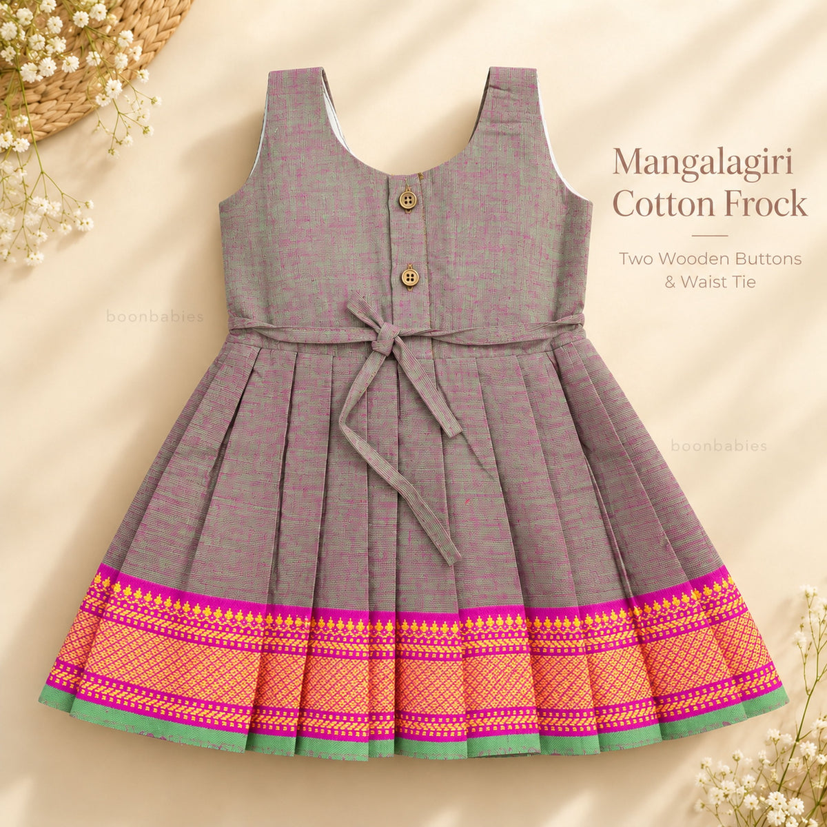 Baby girl grey Mangalagiri cotton frock back view with two wooden buttons, waist tie and pink woven border