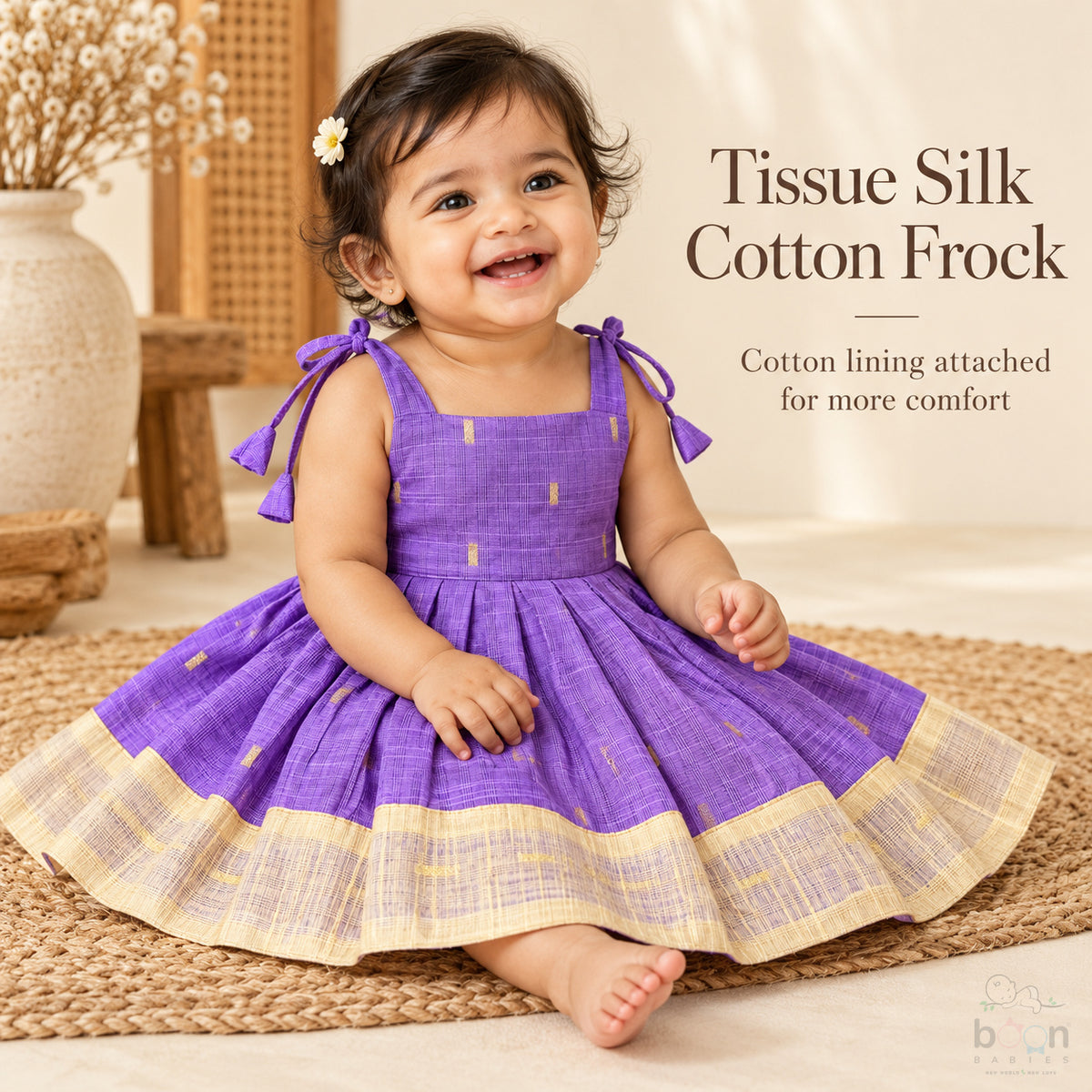 Baby girl wearing purple tissue silk cotton knot frock with cream gold border and woven motifs
