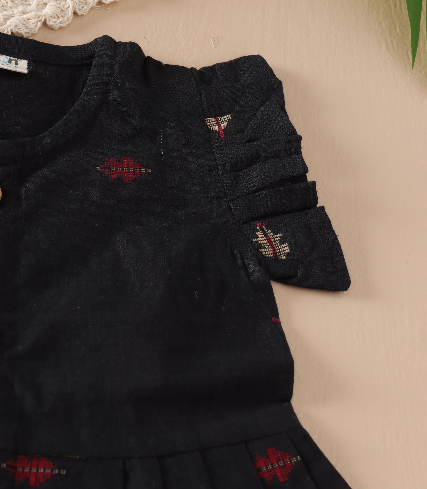 Black South Cotton Baby Frock with Handwoven Butta & Wooden Buttons
