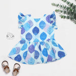 Baby girls hakoba frill frock in blue leaf print (NB–24M). Soft cotton with frill sleeves & button closure – stylish festive & casual outfit.
