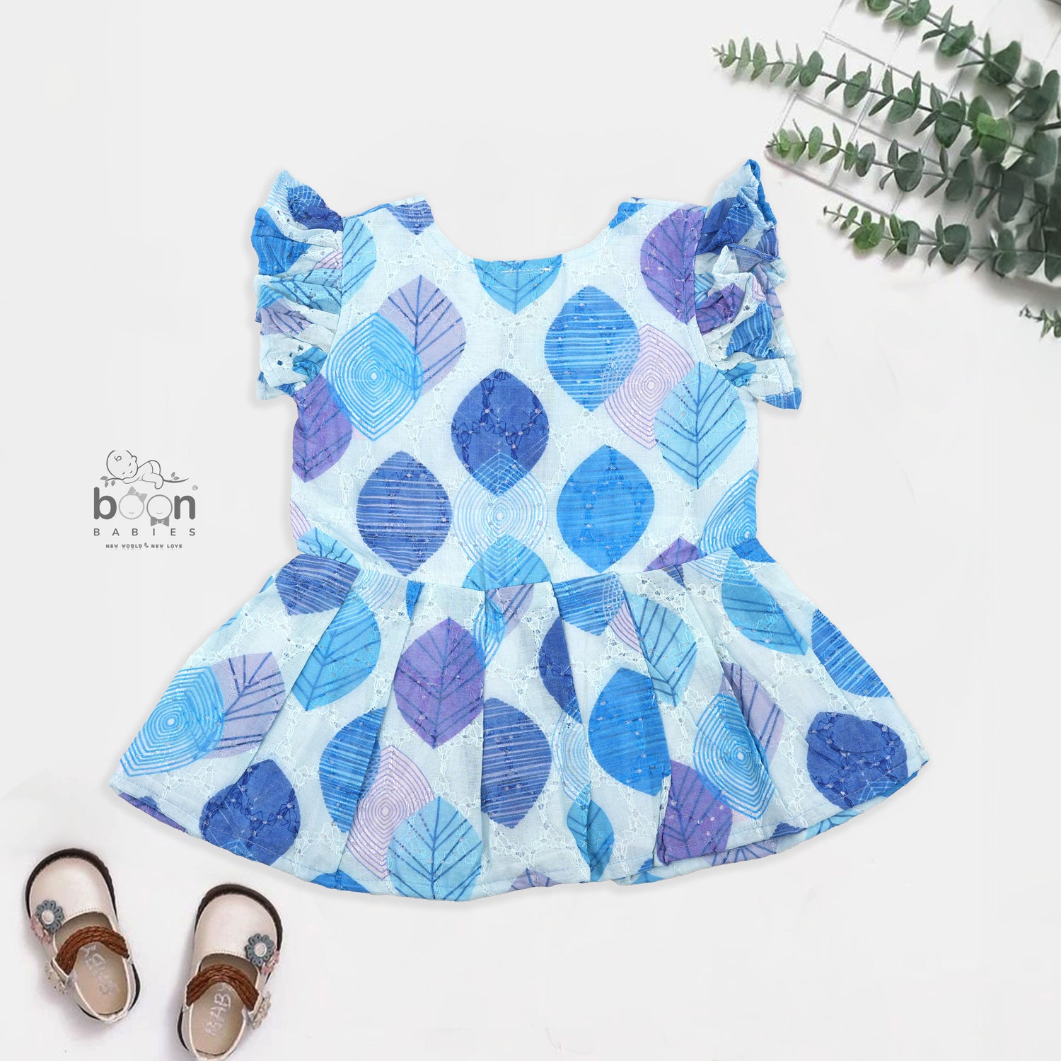 Baby girls hakoba frill frock in blue leaf print (NB–24M). Soft cotton with frill sleeves & button closure – stylish festive & casual outfit.