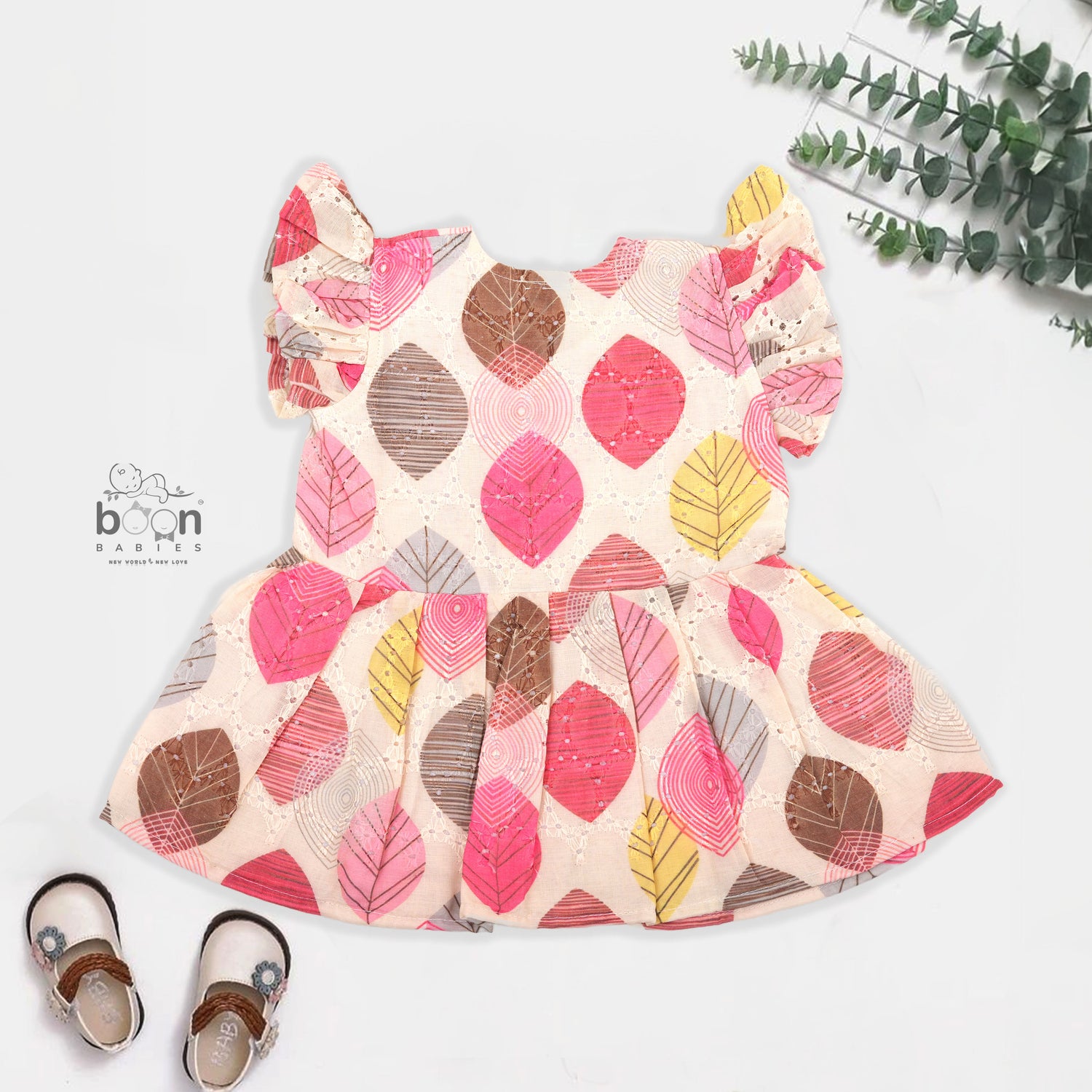 Baby girls hakoba frill frock with red & yellow leaf print (NB–24M). Soft cotton, frill sleeves & button closure – festive & everyday ready.
