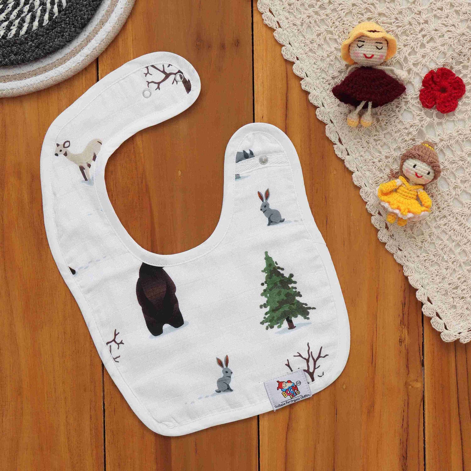 Soft muslin bib with bear and bunny forest prints. Snap-on, breathable, and perfect for feeding and drool-time. Free size fit.