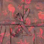 Traditional silk ethnic frock in Rani Pink and Brown for girls aged 1 to 5 years. Features zari motifs and puff sleeves – ideal for weddings and festivals.