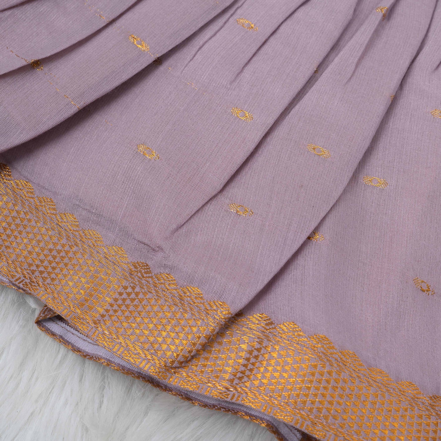 Lavender silk Onam knot frock with zari border & triangle yoke. Ages 0–12M. Perfect festive outfit for baby girls.