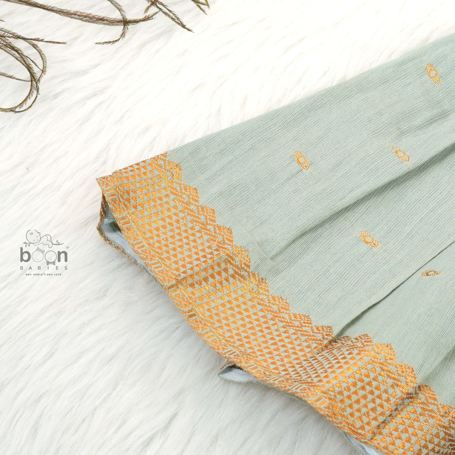 Festive silk knot frock for baby girls (6–12 months) with zari border & tie-up straps. Perfect for Onam & traditional celebrations.
