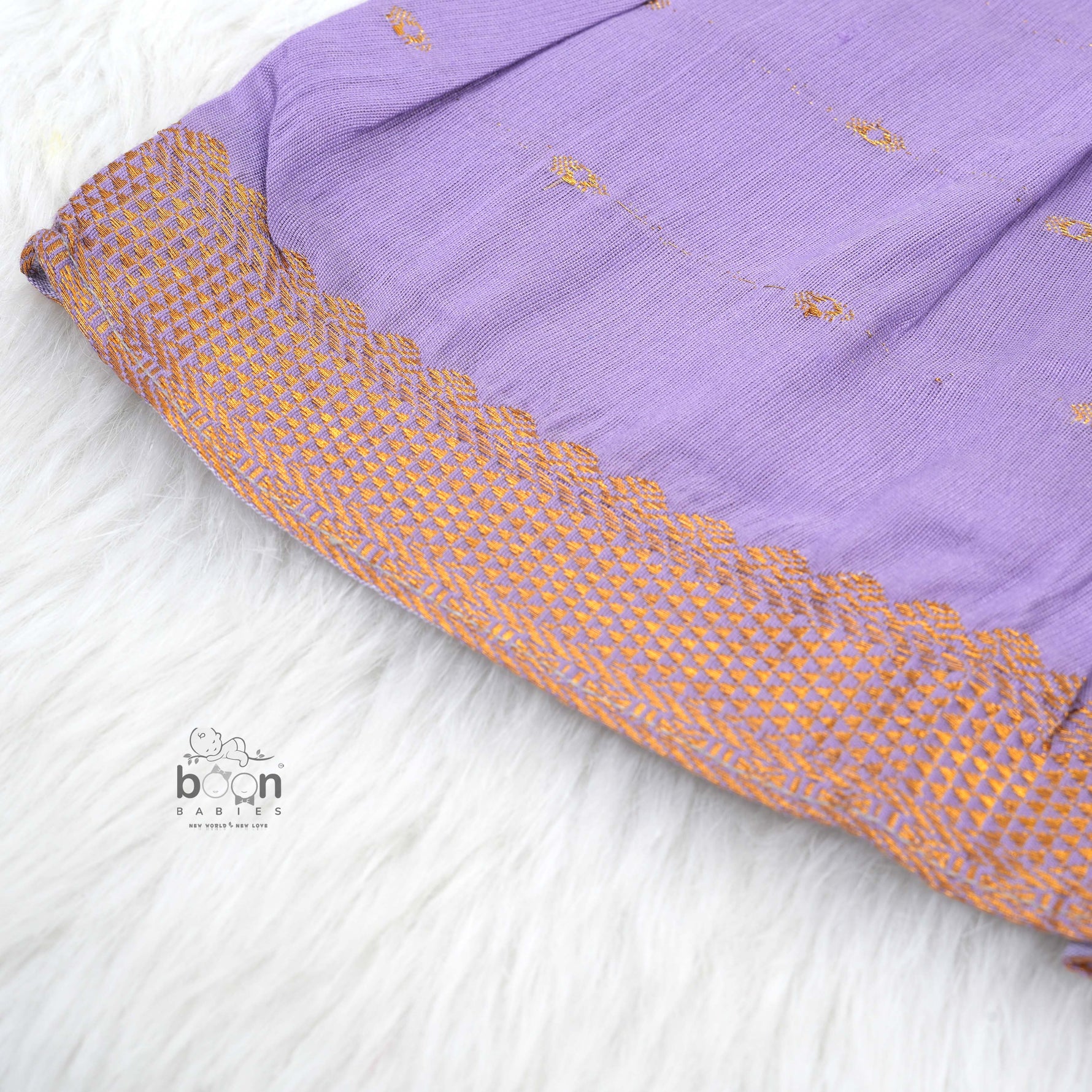 Festive purple silk Onam knot frock with triangle yoke design & zari border. Perfect for baby girls (0–12M).