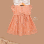 Orange silk ethnic frock for kids by Boon Babies, charming traditional ethnic wear for young children in vibrant orange color.
