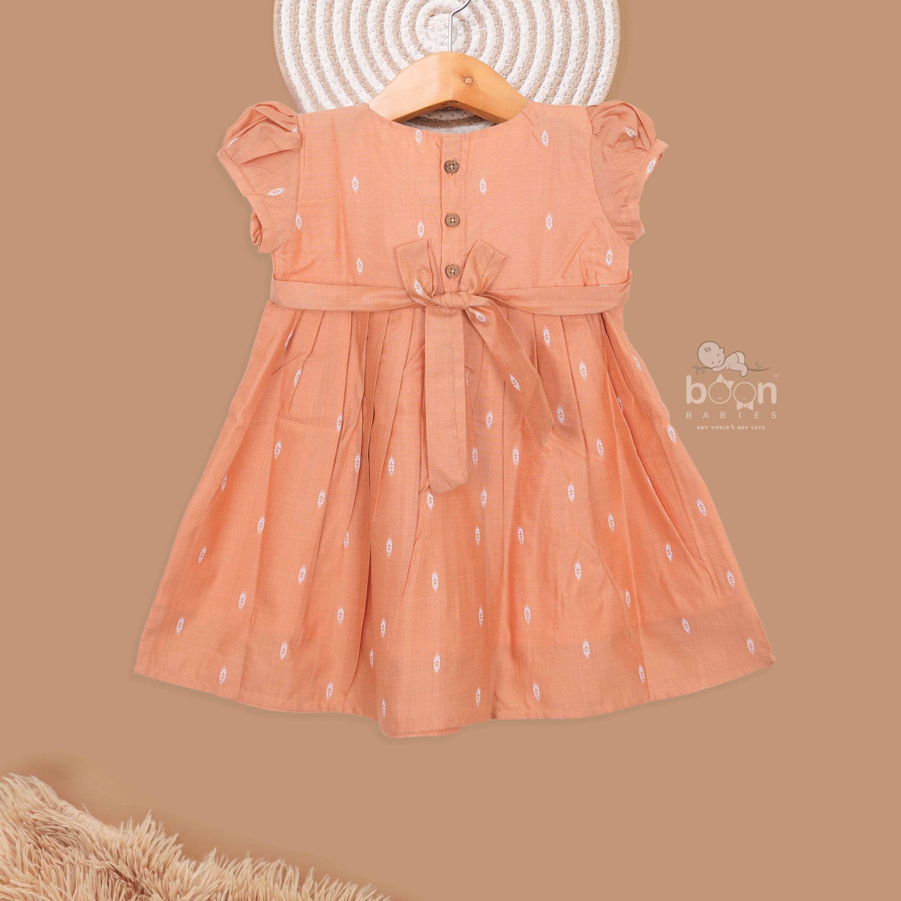 Orange silk ethnic frock for kids by Boon Babies, charming traditional ethnic wear for young children in vibrant orange color.