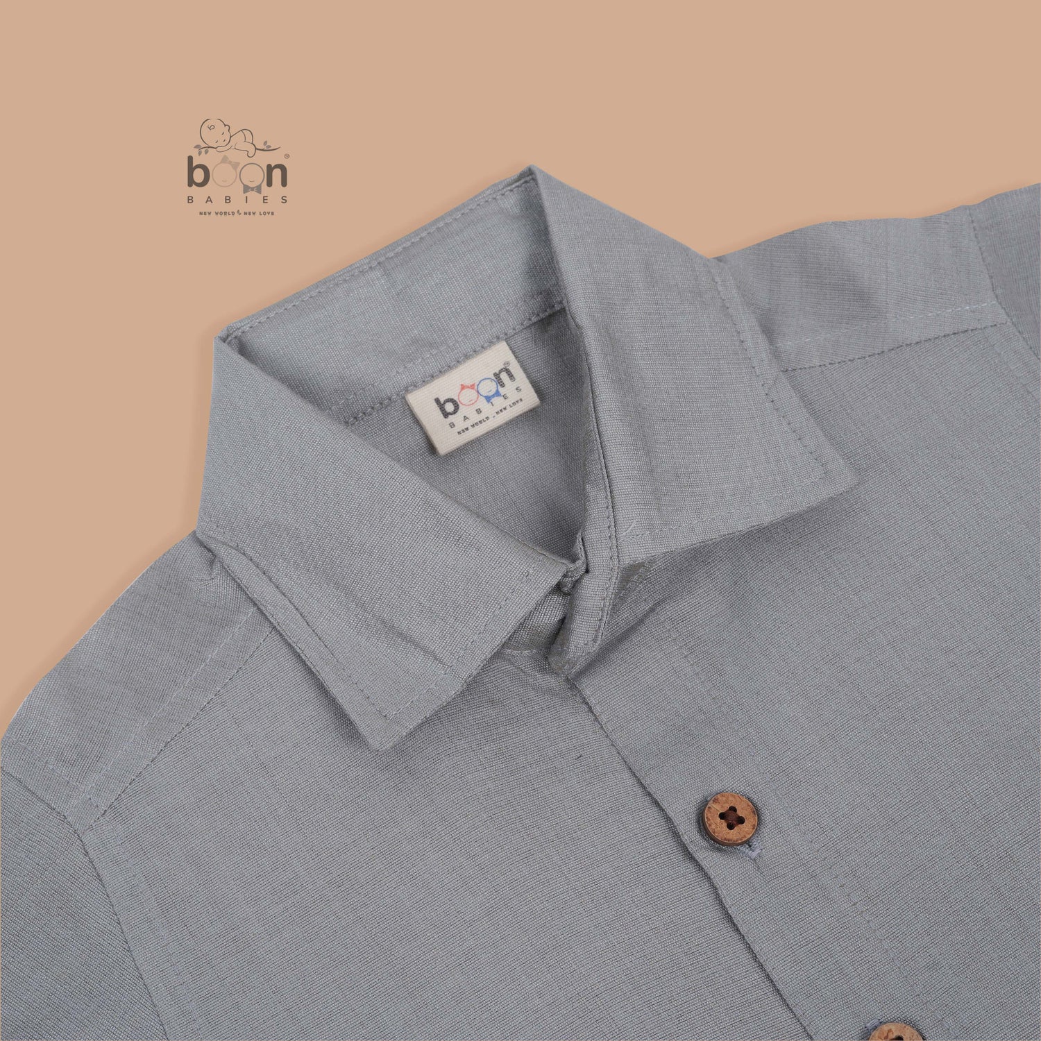 Grey silk dhoti set with golden zari border for boys (6M–5Y). Stylish, festive & comfortable for Onam and special occasions.