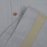 Grey silk dhoti set with golden zari border for boys (6M–5Y). Stylish, festive & comfortable for Onam and special occasions.