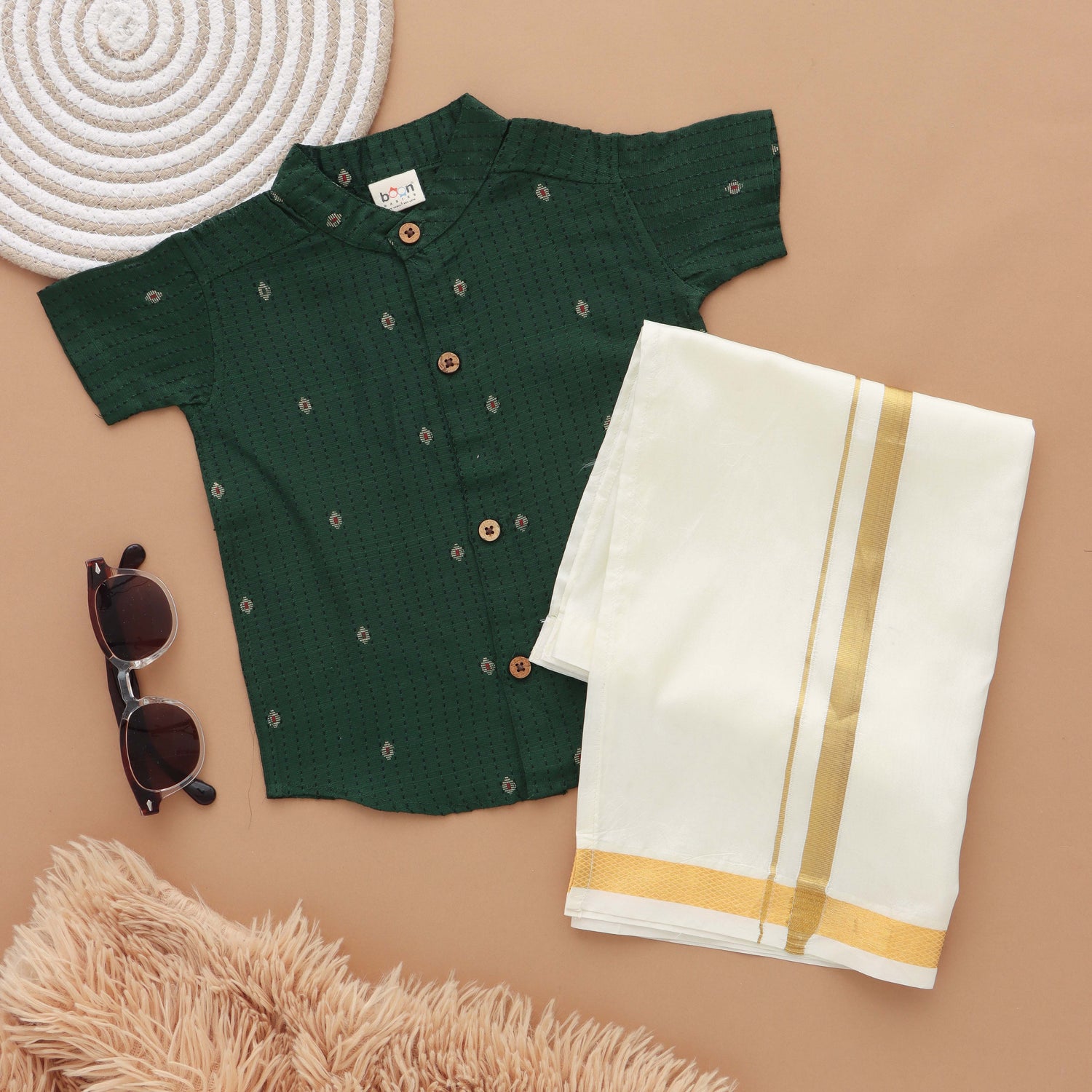 Green silk shirt with Mandarin collar paired with traditional white dhoti. Ages 6M–5Y. Perfect festive & wedding wear from Boon Babies.
