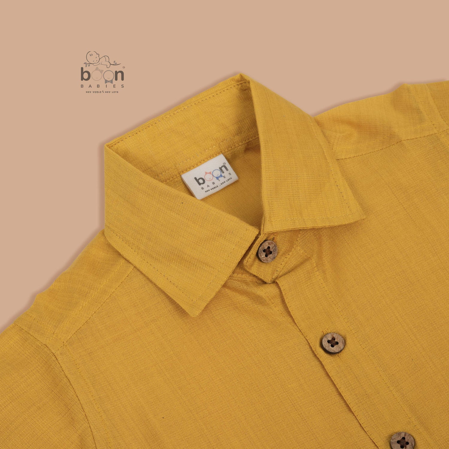 Traditional silk dhoti set in mustard yellow with golden zari border for boys (6M–5Y). Perfect festive wear for Onam & temple visits.