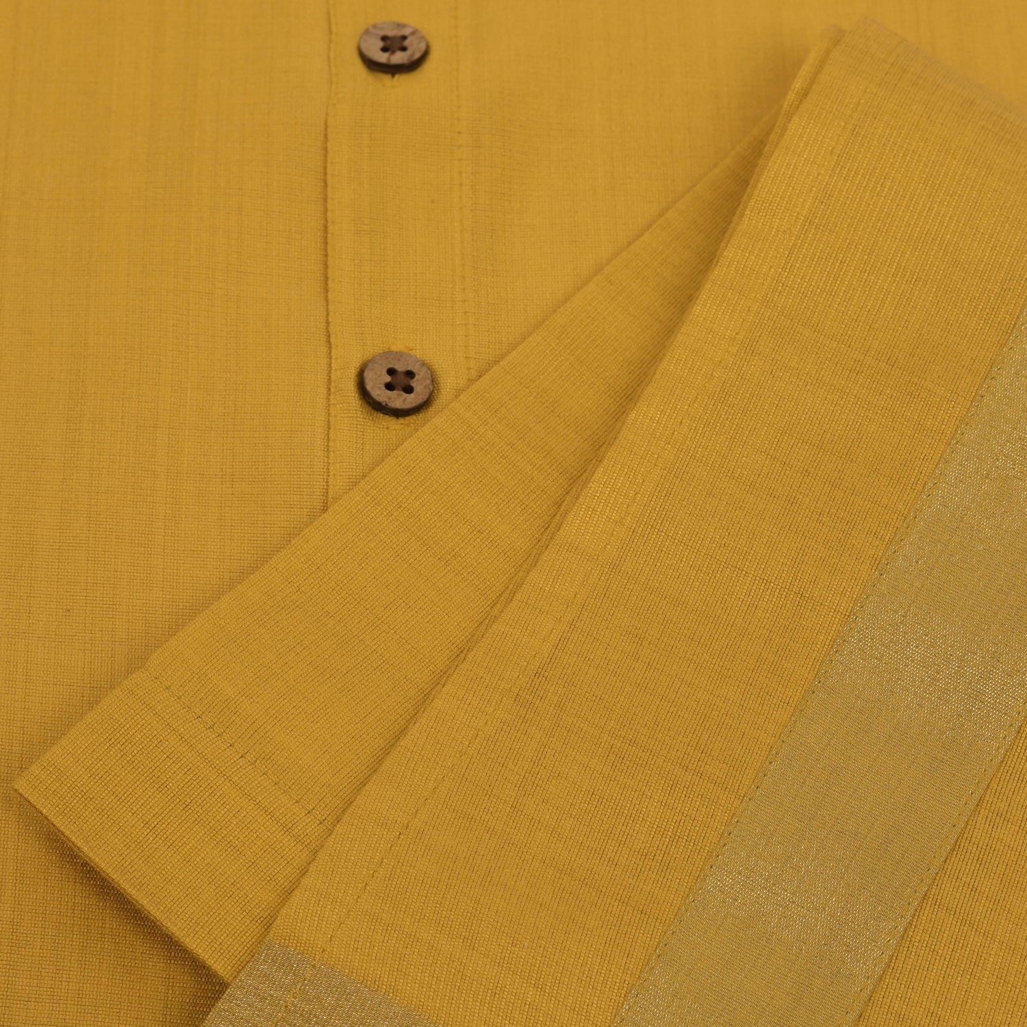 Traditional silk dhoti set in mustard yellow with golden zari border for boys (6M–5Y). Perfect festive wear for Onam & temple visits.