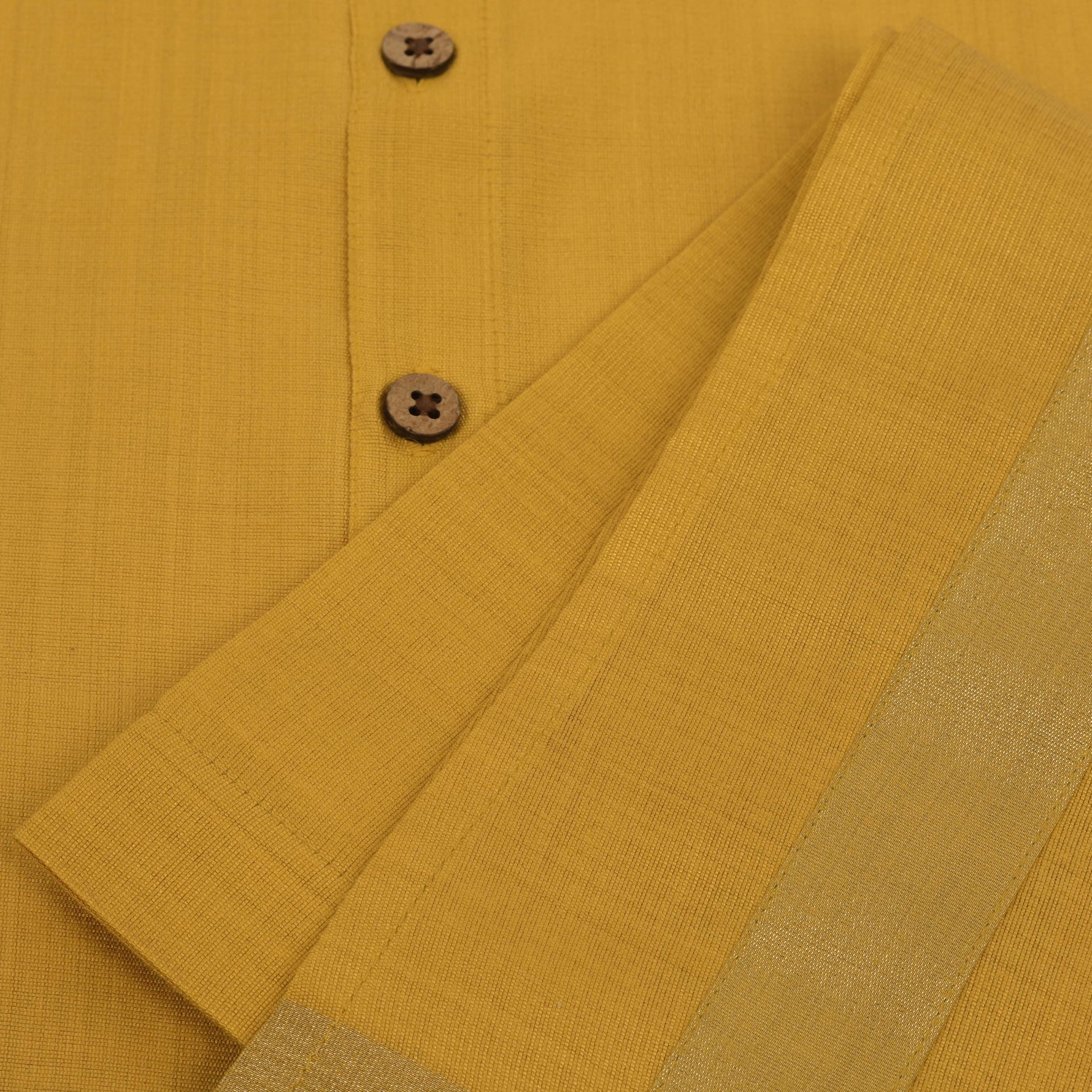 Traditional silk dhoti set in mustard yellow with golden zari border for boys (6M–5Y). Perfect festive wear for Onam & temple visits.