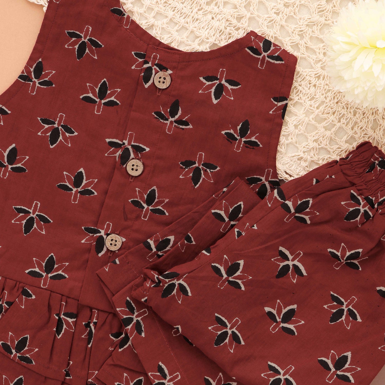 Stylish maroon floral top & pant set in slub cotton with lining. Ages 6M–4Y. A chic and comfortable festive & casual outfit.
