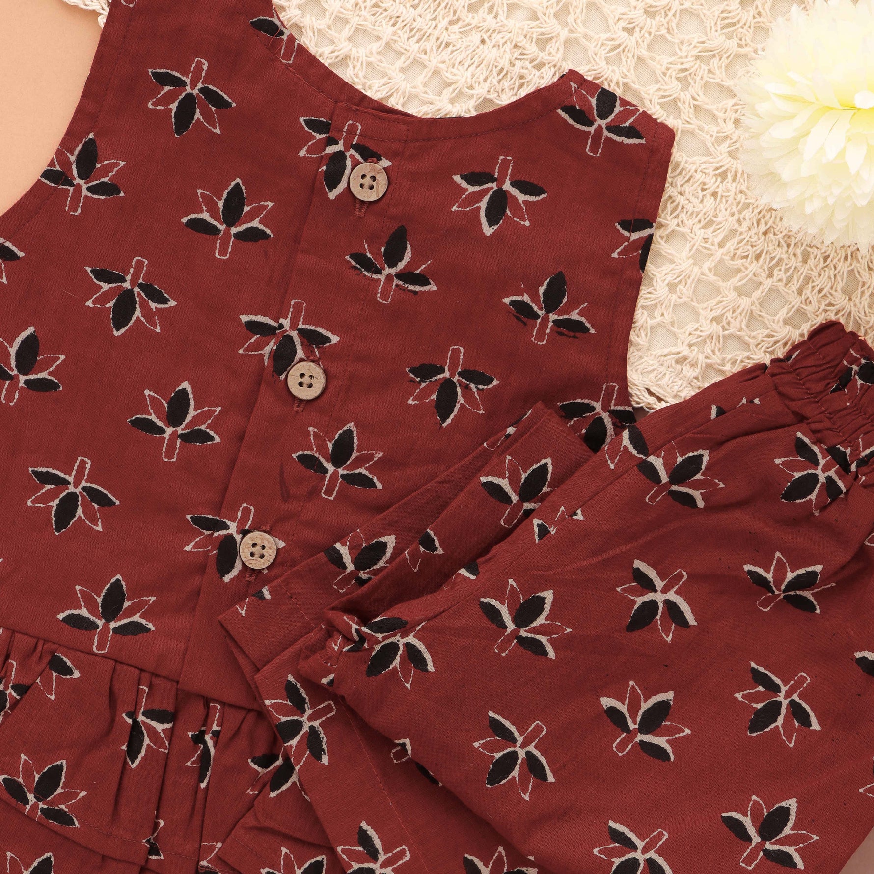 Stylish maroon floral top & pant set in slub cotton with lining. Ages 6M–4Y. A chic and comfortable festive & casual outfit.