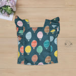 Cotton frill top & shorts set with teal base and multicolor hot air balloon print. Sizes 6M–5Y. Cute, comfy & playful casual wear for girls.

