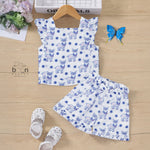 White cotton frill top & shorts set with blue reindeer print. Ages 6M–5Y. Cute, comfy & festive casual wear for baby girls
