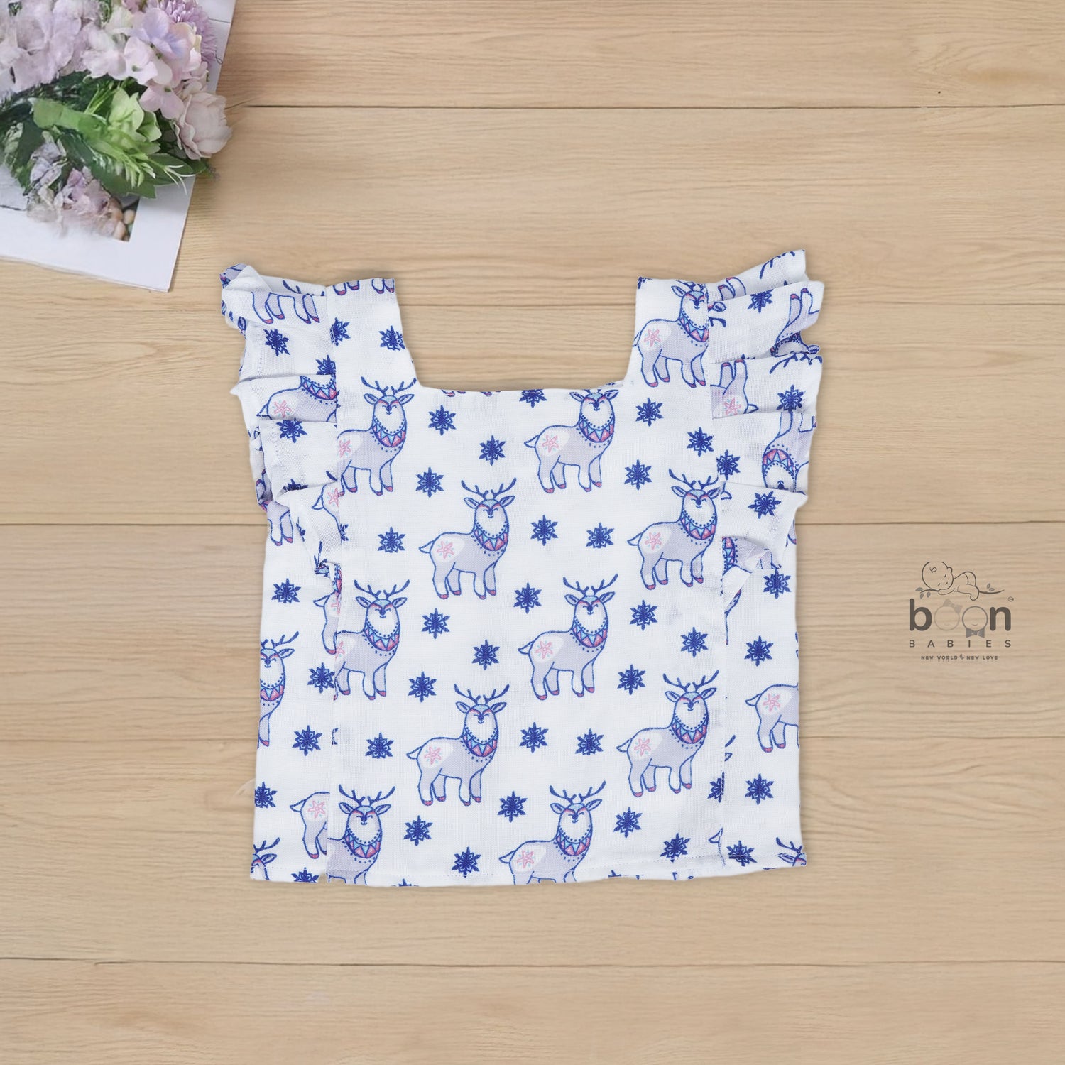White cotton frill top & shorts set with blue reindeer print. Ages 6M–5Y. Cute, comfy & festive casual wear for baby girls