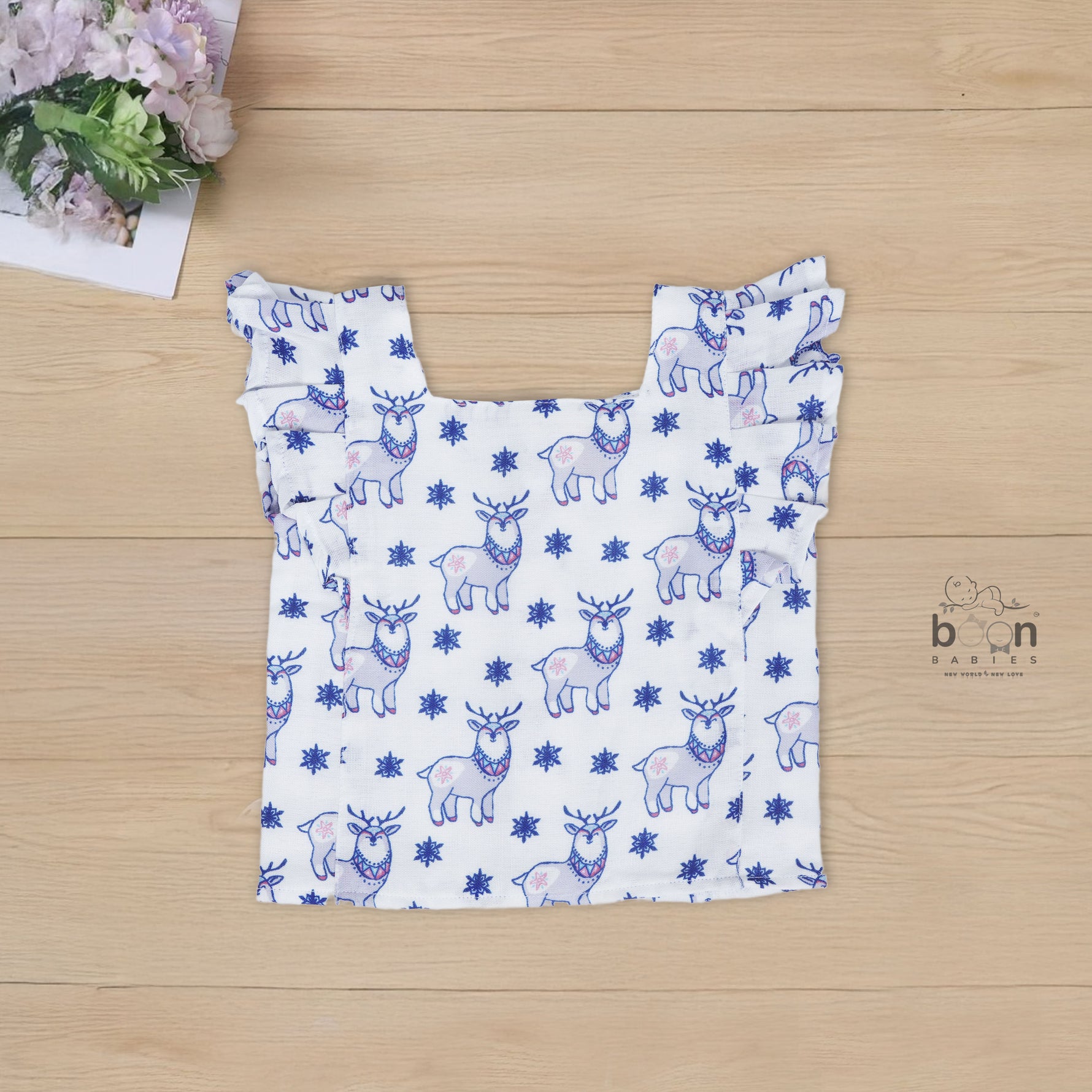 White cotton frill top & shorts set with blue reindeer print. Ages 6M–5Y. Cute, comfy & festive casual wear for baby girls