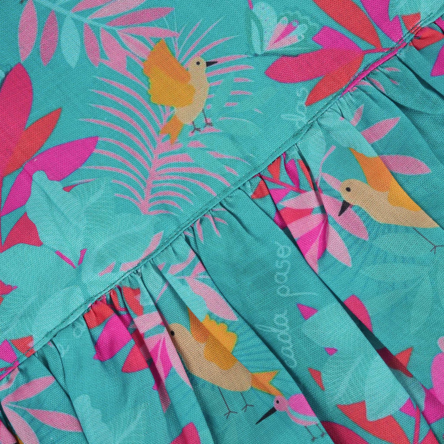 Aqua blue sleeveless frock for girls aged 1 to 4 years, made of slub cotton with colorful tropical bird and leaf print – from Boon Babies, Coimbatore.