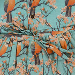 Sleeveless aqua frock with orange birds and peach blossoms printed on soft slub cotton fabric – suitable for girls aged 1 to 4 years from Boon Babies, Coimbatore.