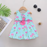 Adorable sleeveless cotton frock with pink lotus prints & bow. Ages 1–4 years. Comfortable, stylish & perfect for festive and casual occasions.