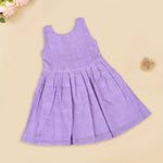 Lilac sleeveless Hakoba frock for baby girls, featuring floral embroidery and soft pleats, displayed flat on a beige background with a decorative heart and flowers.