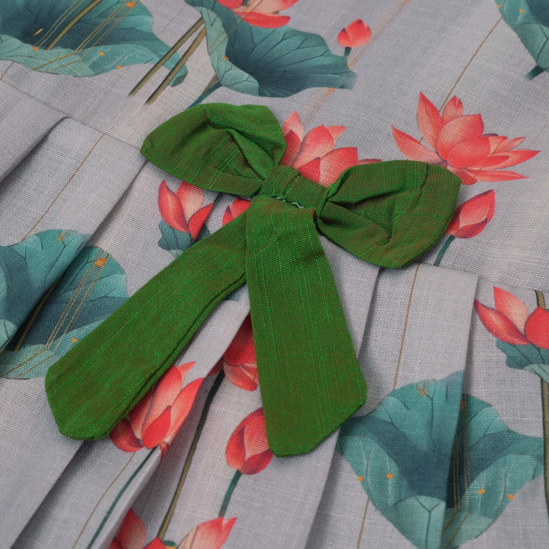 Cute cotton sleeveless frock with lotus print & bow. Perfect for ages 1–4 years. Stylish, breathable & comfy for everyday and festive wear.