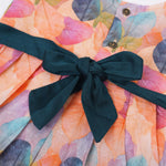Colorful sleeveless cotton frock with multicolor leaf prints & bow. Ages 1–4 years. Perfect for festive outings, birthdays & everyday cuteness.
