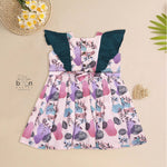 Girls pastel digital printed slub cotton frock with front ruffle frills (1–4Y). Stylish, breathable & perfect for festive and casual wear.