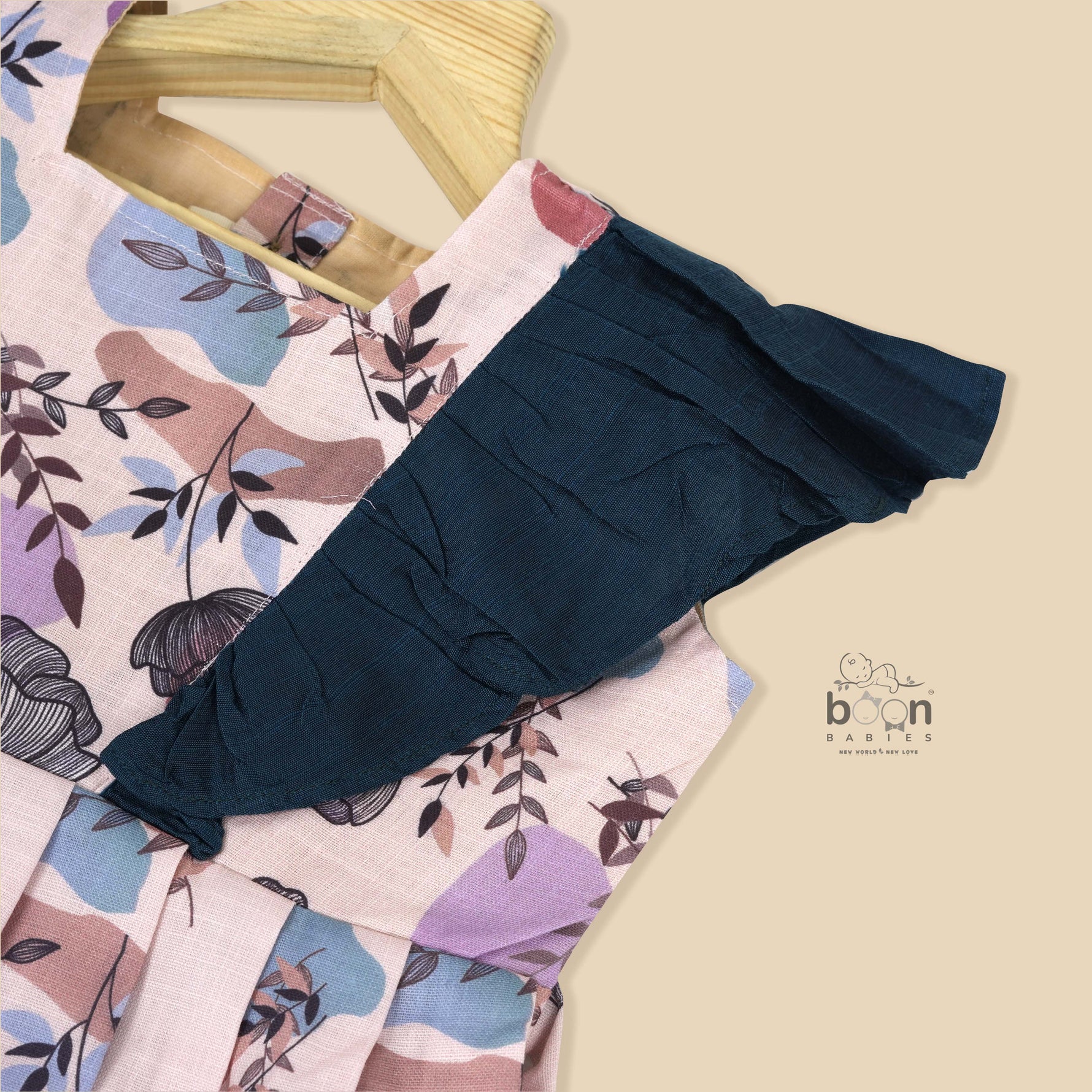 Girls pastel digital printed slub cotton frock with front ruffle frills (1–4Y). Stylish, breathable & perfect for festive and casual wear.