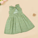 Pastel green sleeveless Hakoba frock for baby girls, featuring floral embroidery and pleated skirt design. Lightweight cotton fabric, displayed flat against a soft beige background with a decorative heart and flowers.